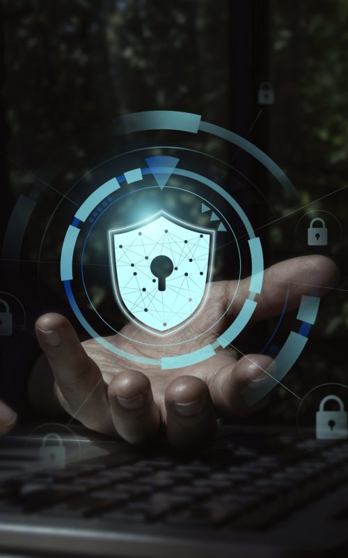 Secure data, Internet security data protection with business technology privacy concept. Safety virtual icon, shield, padlock on cyber network connection in businessman's hand while using laptop.